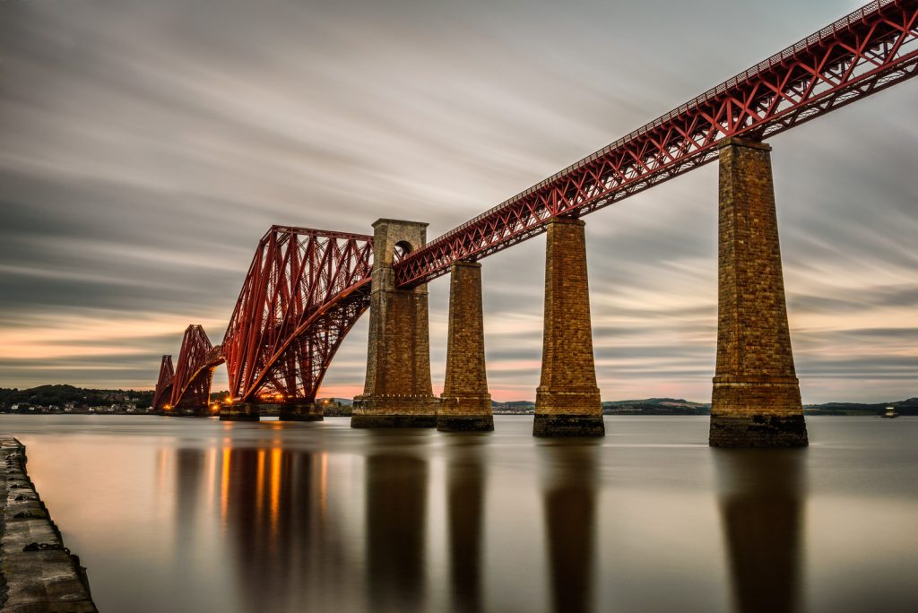 A bridge over a body of water  Description automatically generated